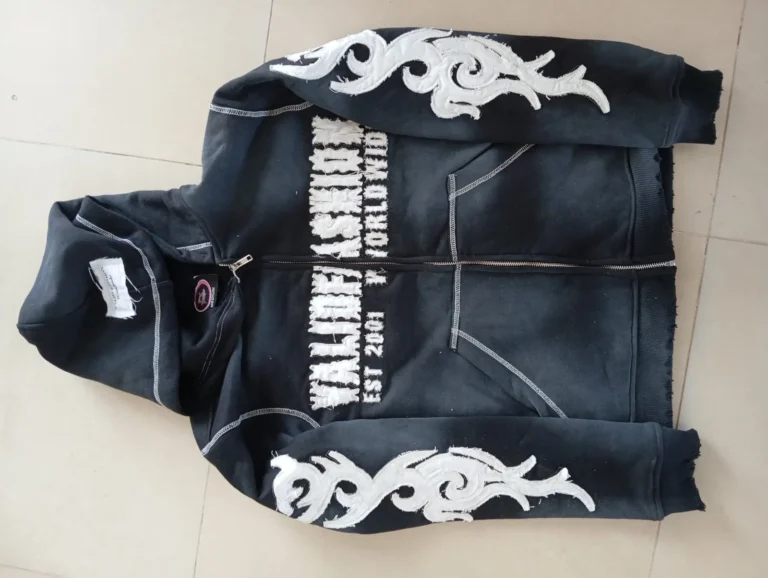 Back of custom black hoodie with tribal print and lettering – made by Naxon Sports