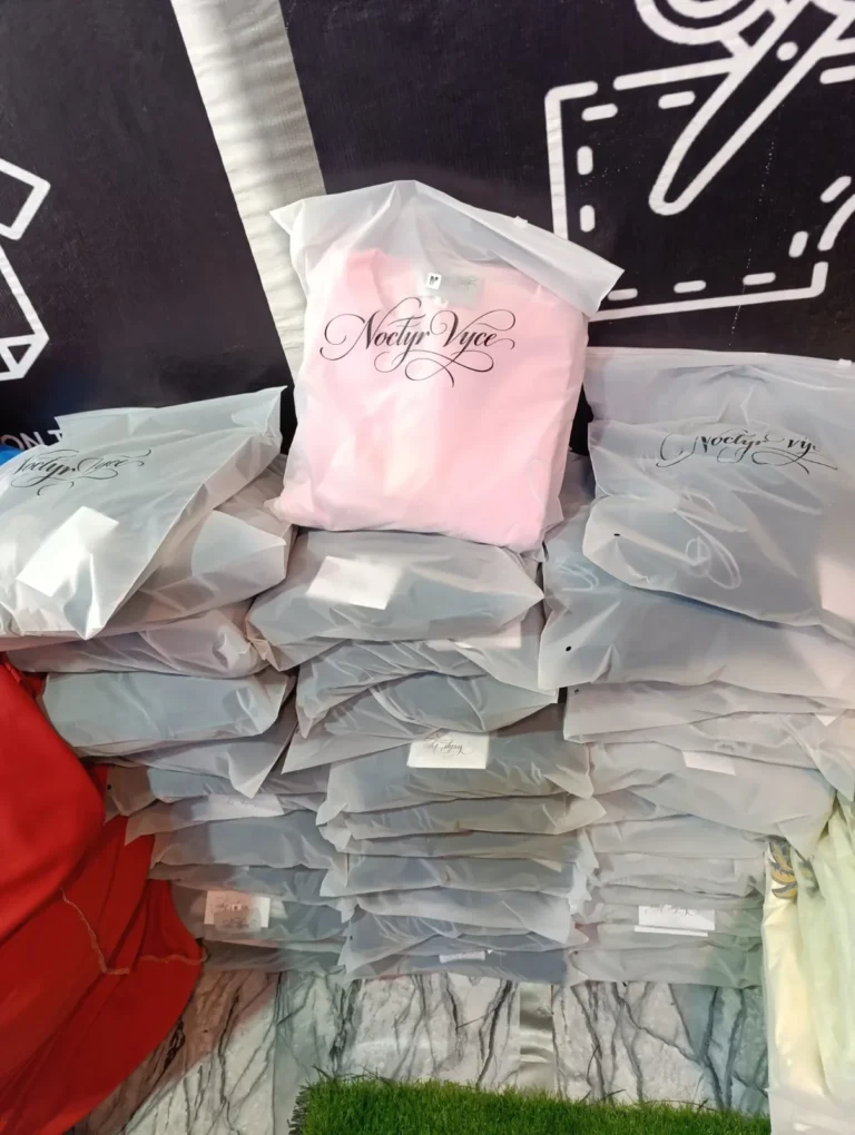 Bulk order of custom garments packed with labels – made by Naxon Sports