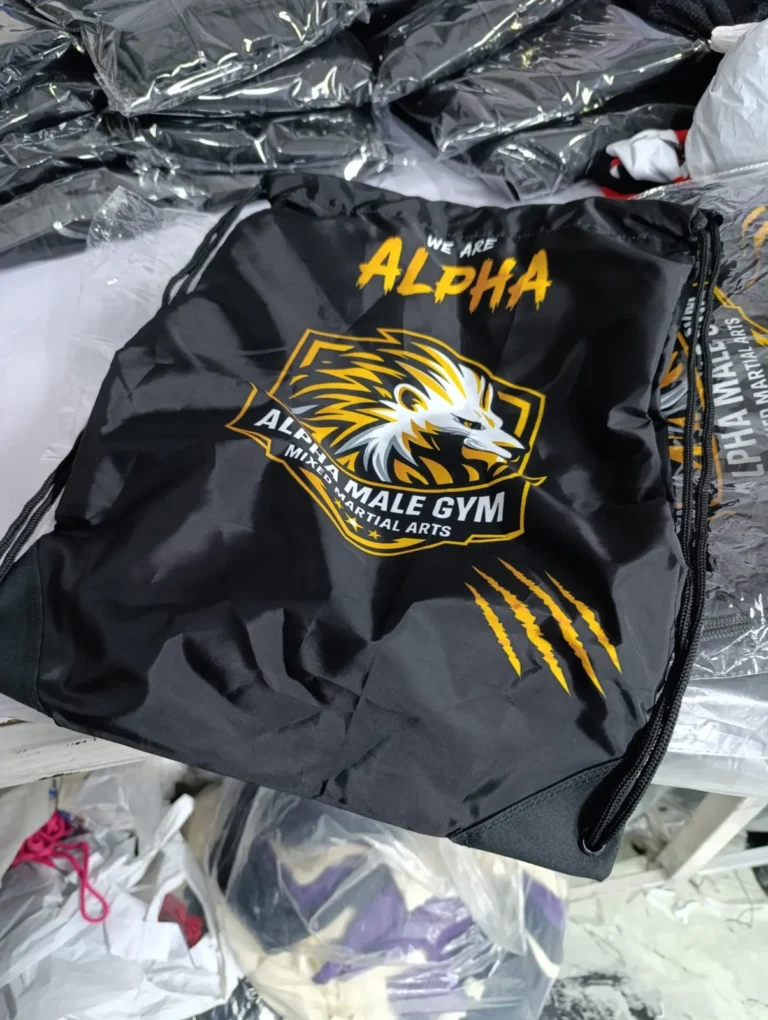 Custom black and gold MMA shorts with eagle print – made by Naxon Sports