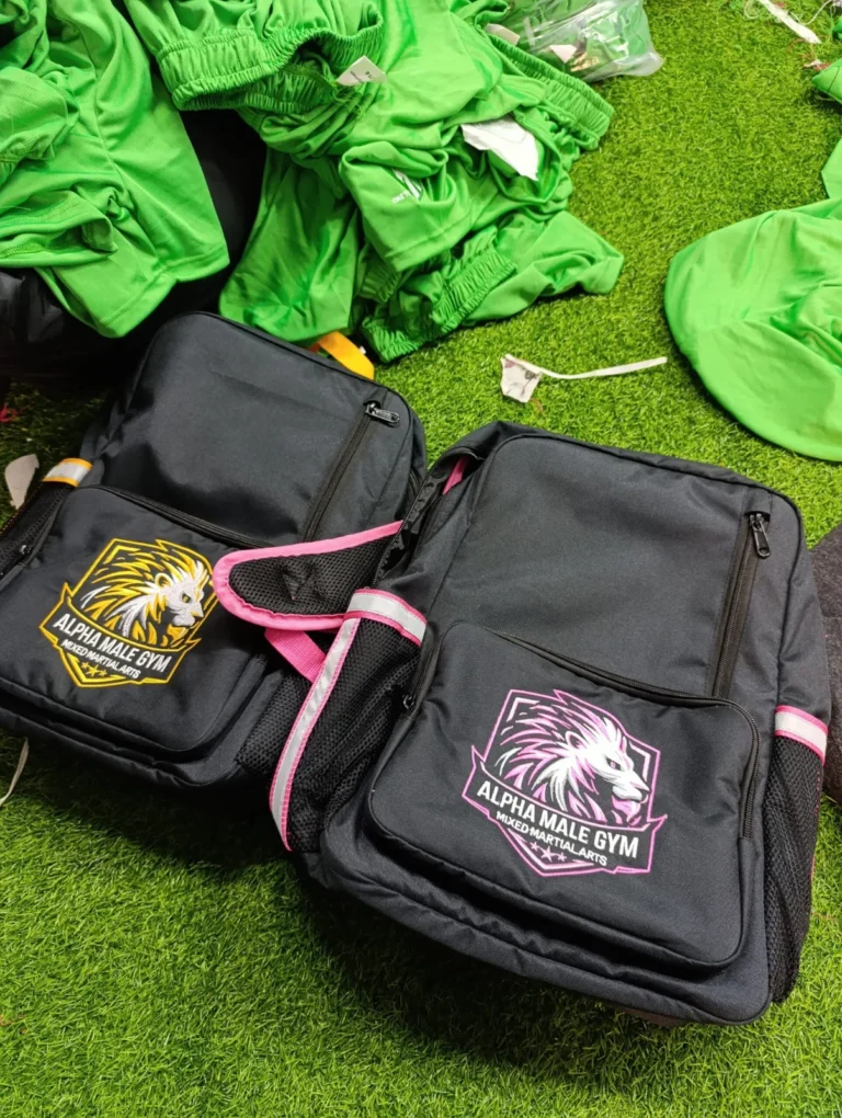 Custom black and pink bags with printed logos – made by Naxon Sports