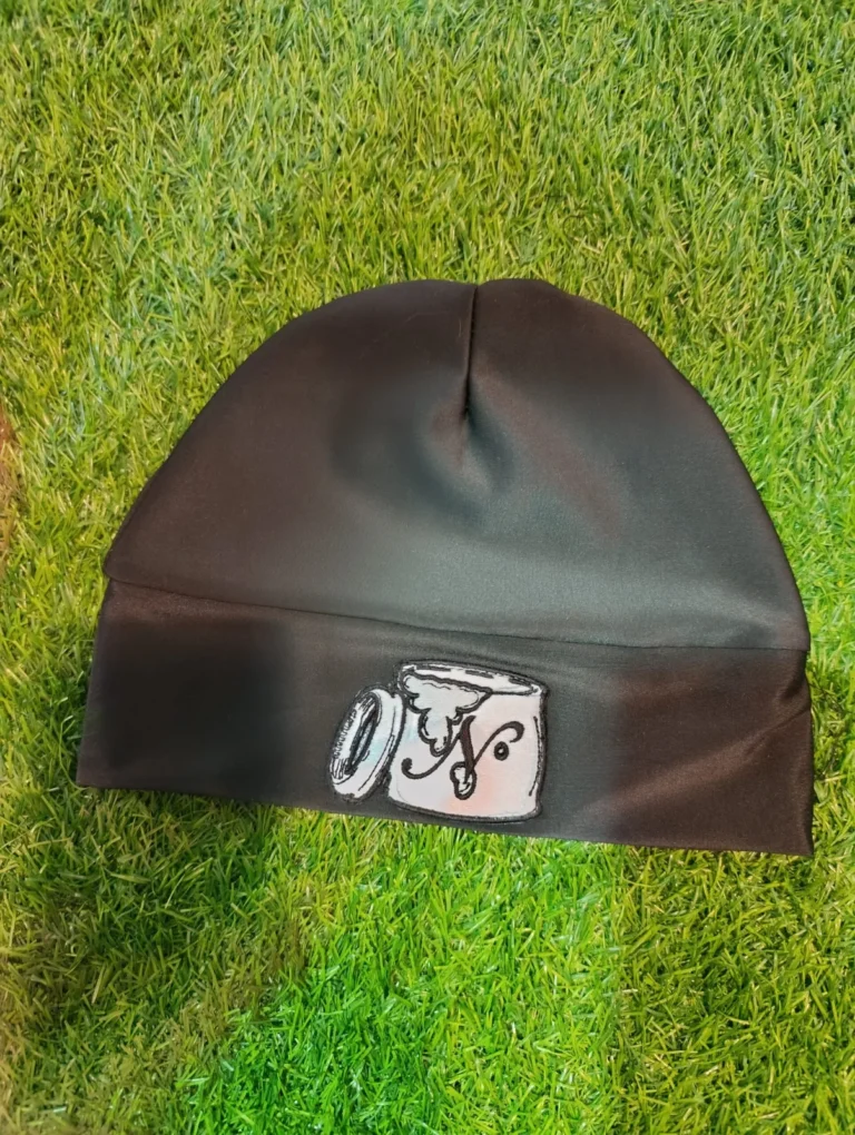 Custom black beanie with woven label – made by Naxon Sports