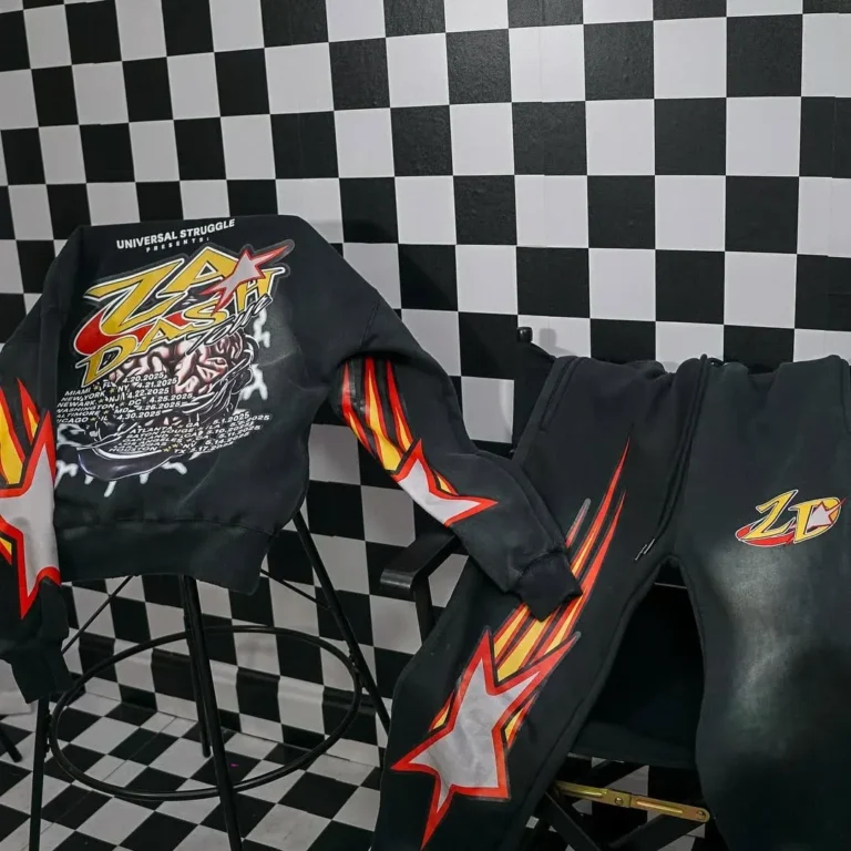 Custom black hoodie and jeans with flame graphics, flat lay – made by Naxon Sports
