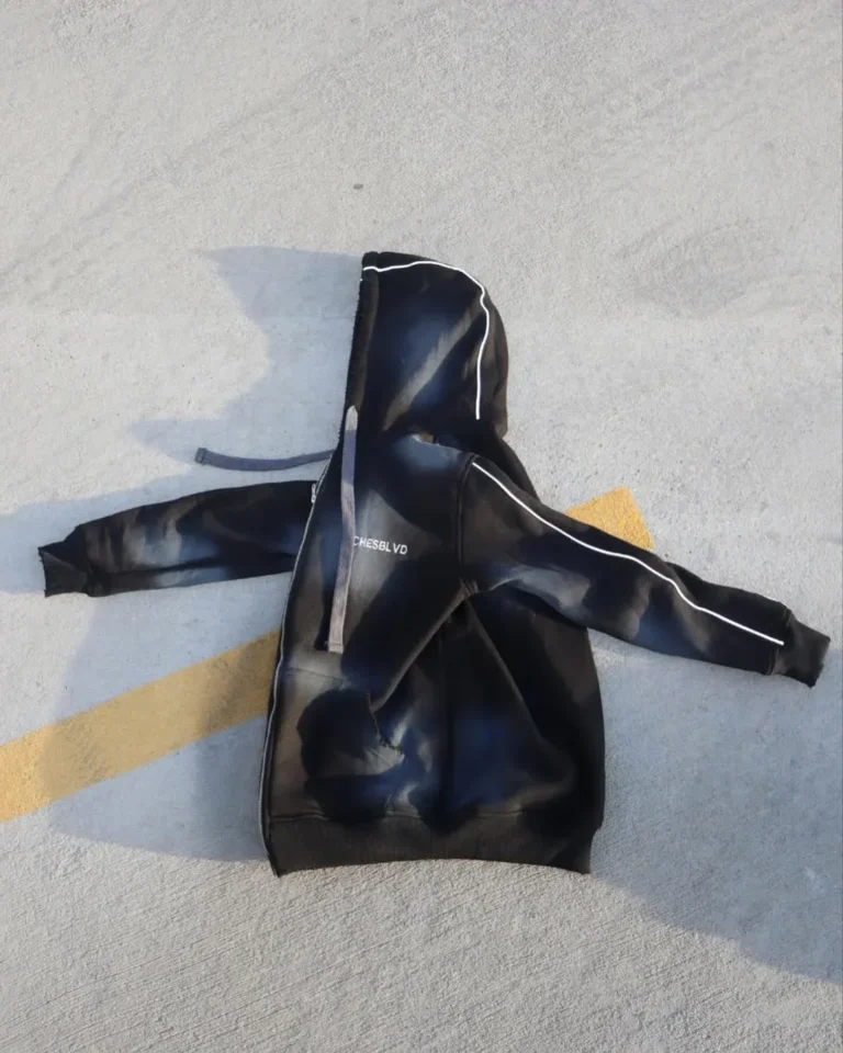 Custom black hoodie, flat lay product photo – made by Naxon Sports