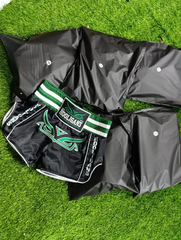 Custom black jackets with green trim – made by Naxon Sports
