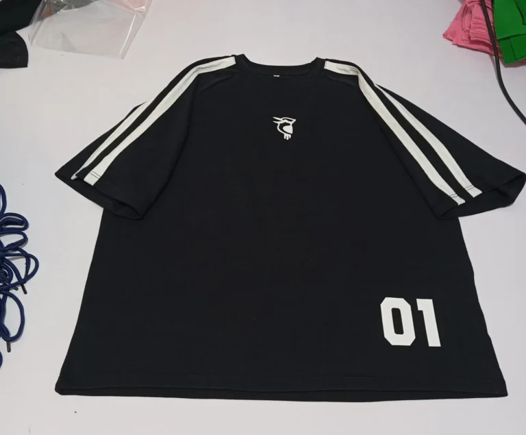 Custom black jersey t-shirt with stripes and number – made by Naxon Sports