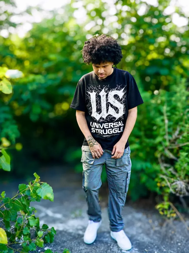 Custom black printed t-shirt worn outdoors, client photoshoot – made by Naxon Sports