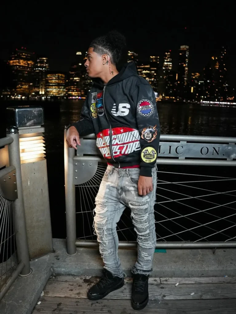 Custom black racing-style jacket worn with jeans, client photoshoot – made by Naxon Sports