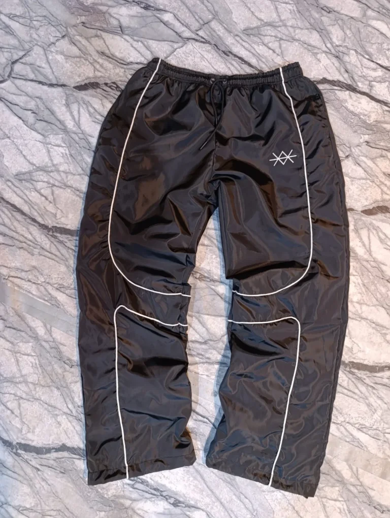 Custom black track pants with white piping – made by Naxon Sports