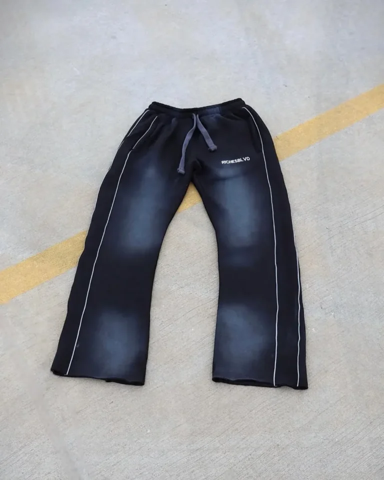 Custom black washed flare sweatpants, flat lay – made by Naxon Sports
