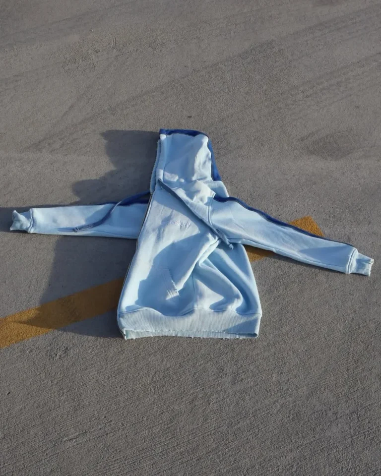 Custom light blue washed hoodie, flat lay – made by Naxon Sports