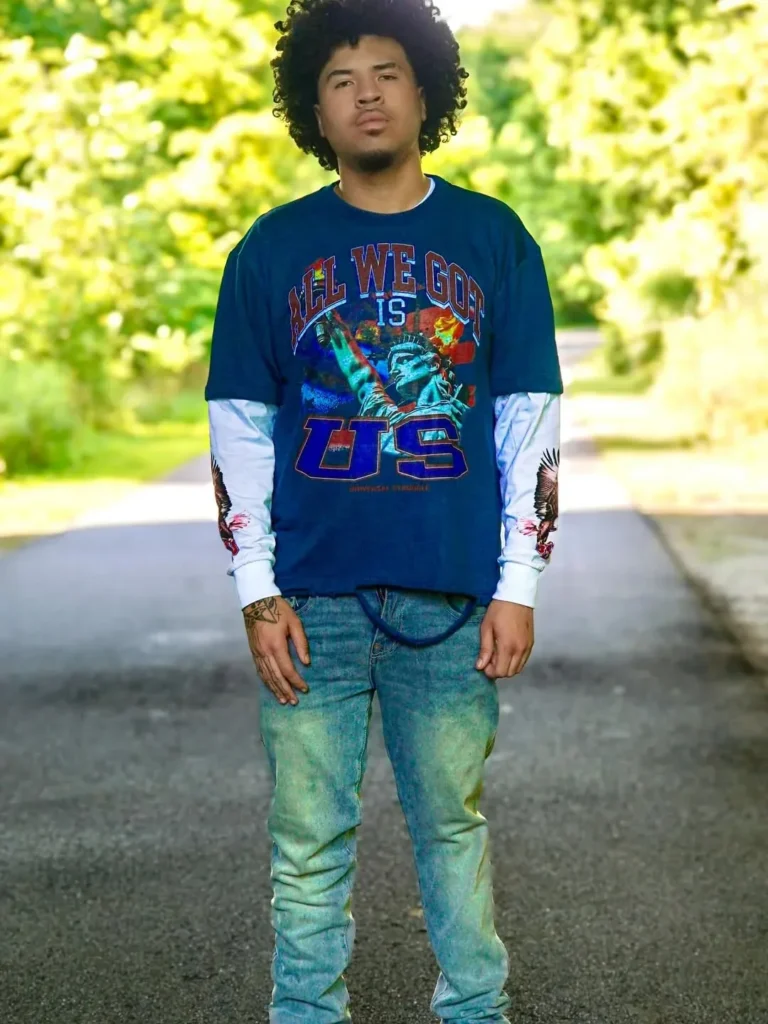 Custom navy graphic t-shirt worn with jeans, client photoshoot – made by Naxon Sports