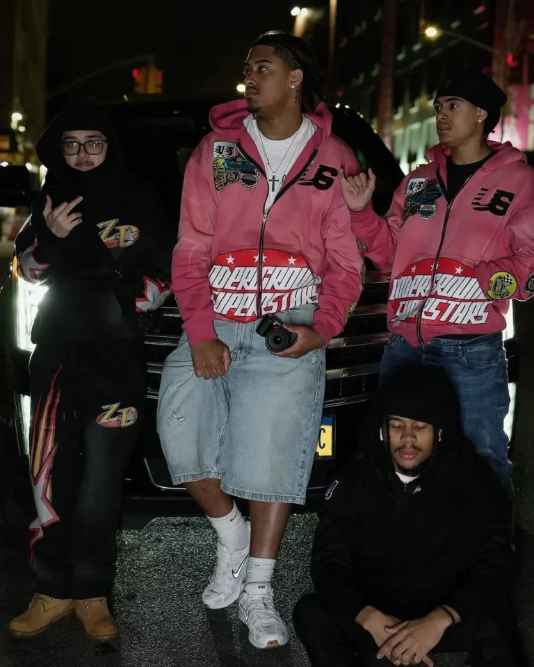 Custom pink racing jackets worn by a group, client photoshoot – made by Naxon Sports