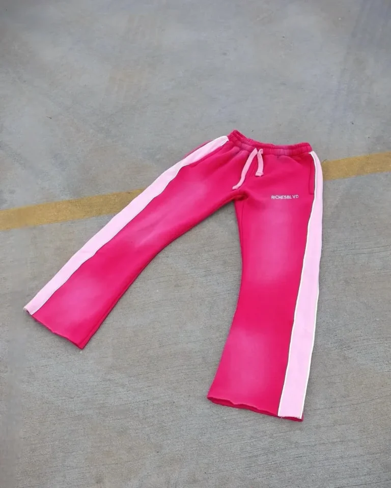 Custom pink washed flare sweatpants, flat lay – made by Naxon Sports