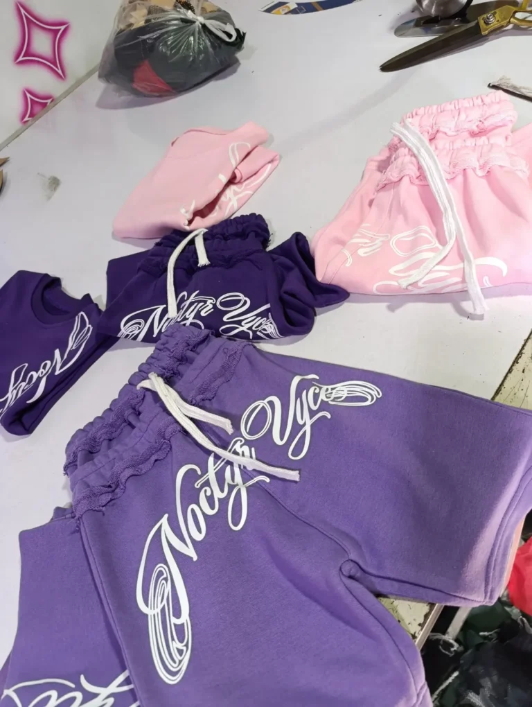 Custom purple and pink sets with script print – made by Naxon Sports