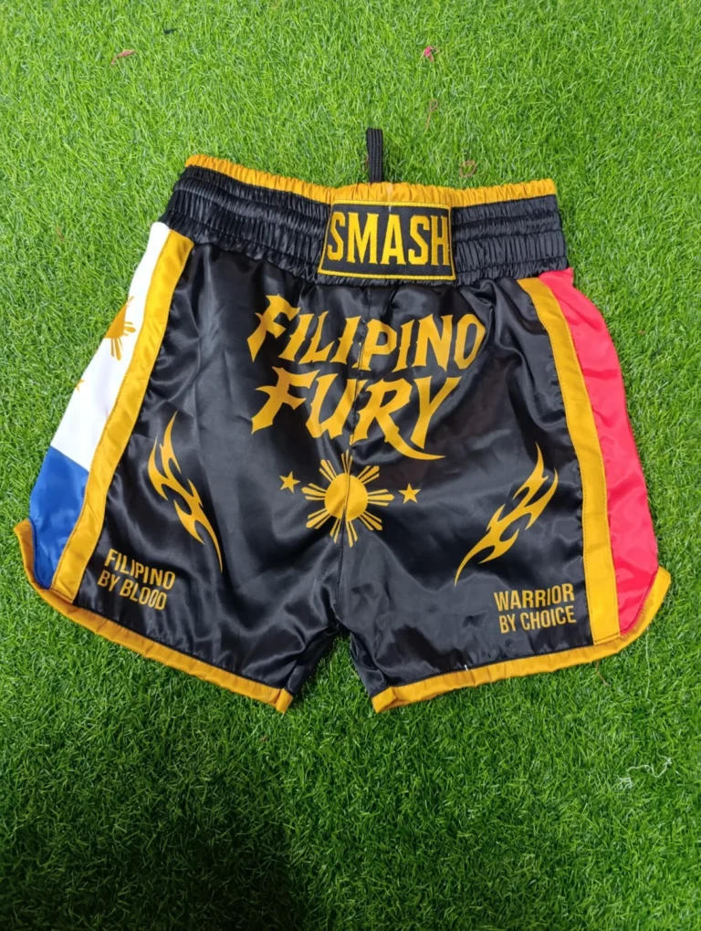 Custom sublimated Muay Thai shorts with bold lettering – made by Naxon Sports