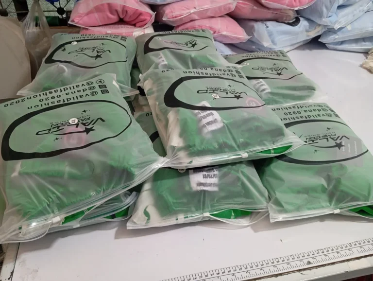 Green custom garments packed in polybags for a bulk order – made by Naxon Sports