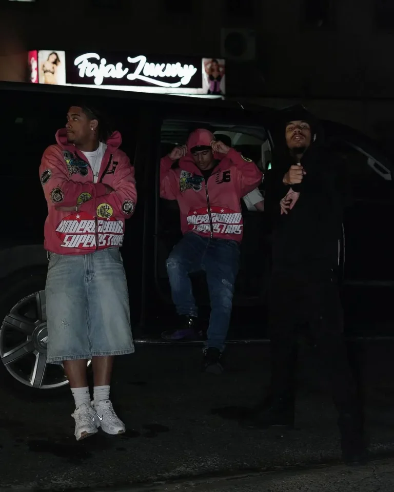 Models in matching custom pink racing jackets – made by Naxon Sports