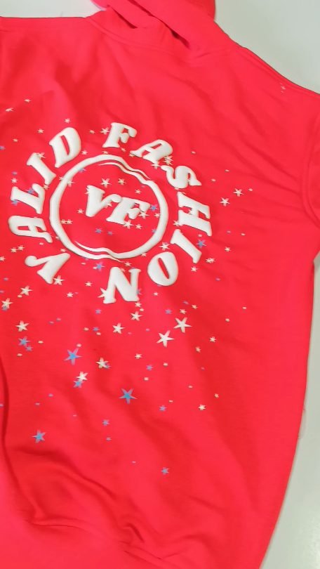 Red sweatshirt with a raised white puff print logo and star print, made at Naxon Sports factory in Sialkot