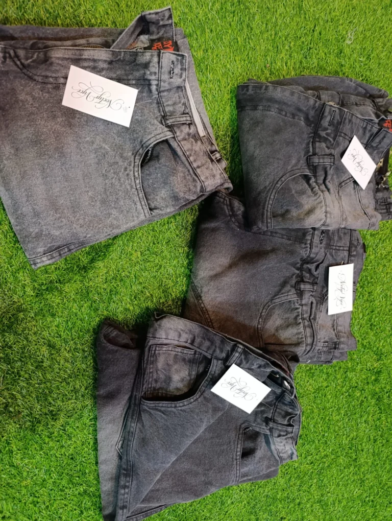 Stack of custom washed denim jeans – made by Naxon Sports