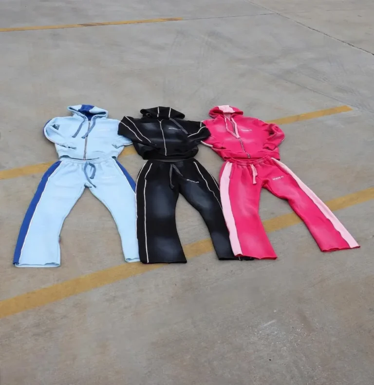Three custom tracksuits in blue, black and pink, flat lay – made by Naxon Sports